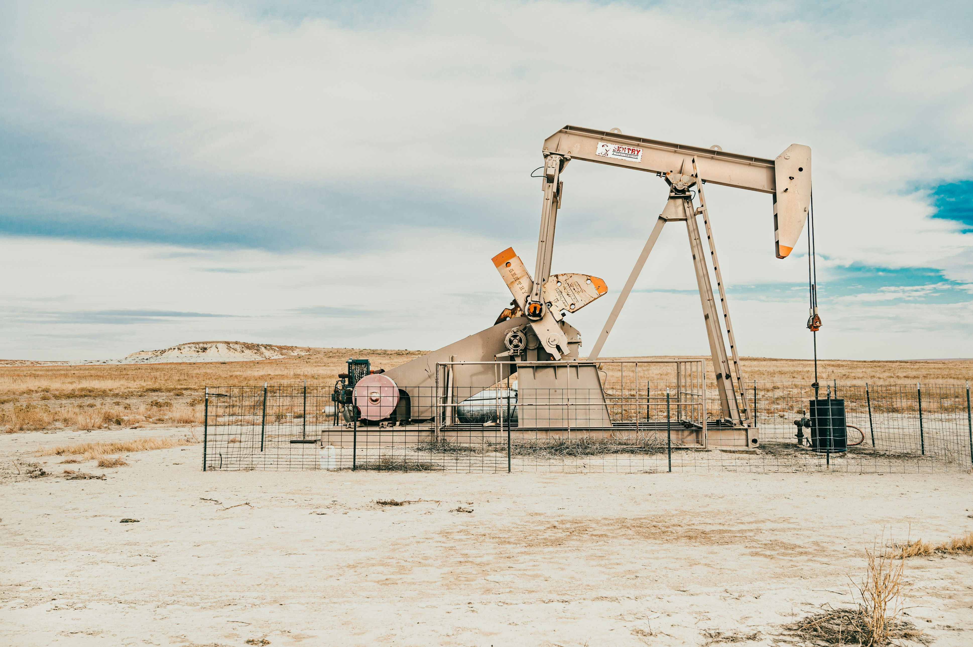Photo by Colton Sturgeon on Unsplash Oil pumpjack equipment in the field