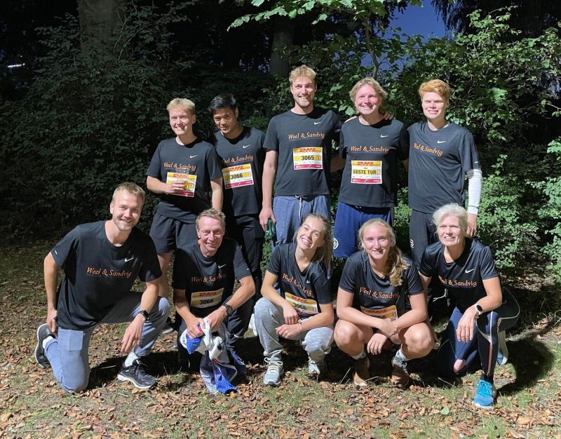 Weel & Sandvig team posing together after a DHL relay race